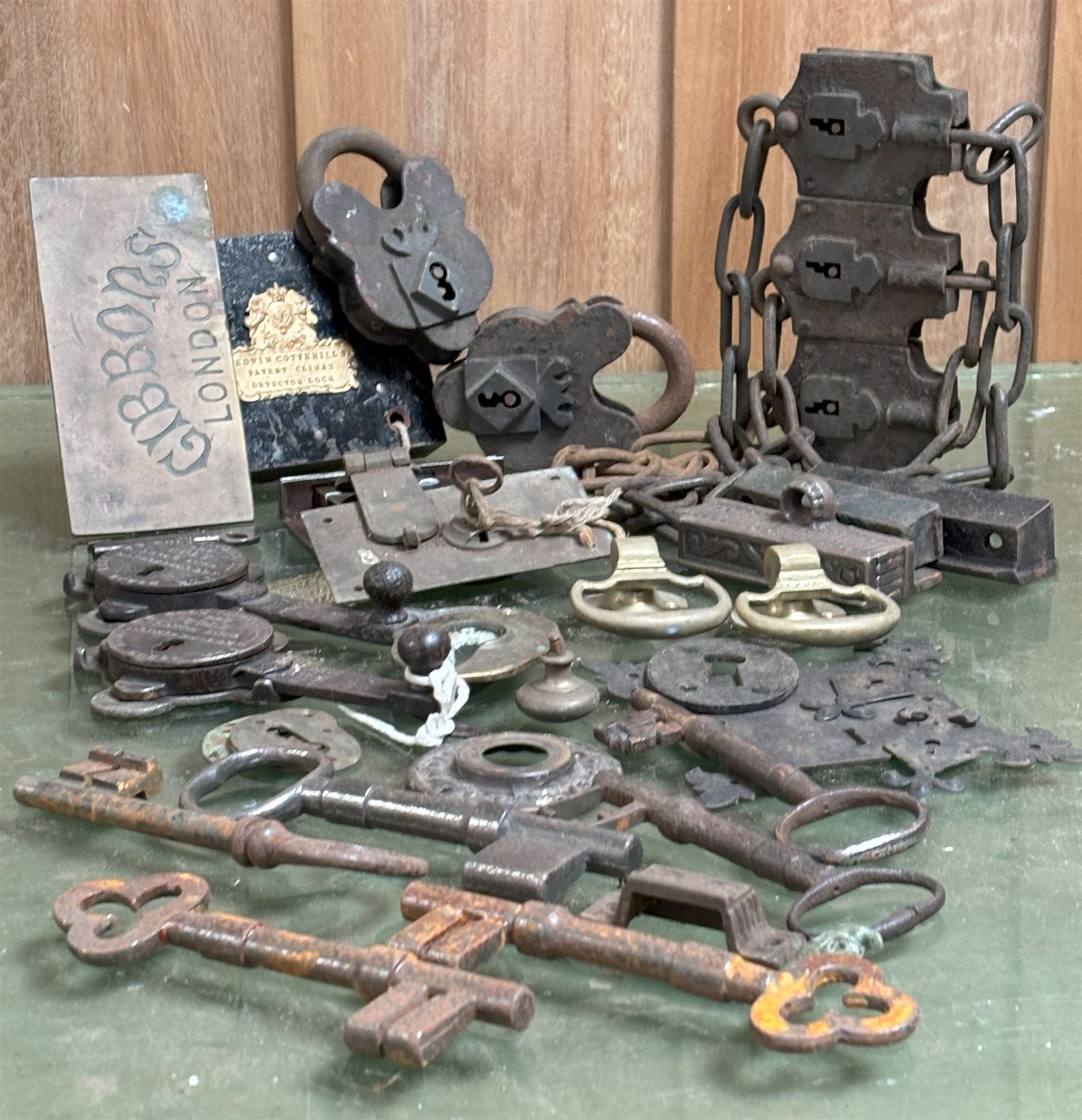 Victorian Edwin Cotterill's patent lock with key, a set of three 19th century chain padlocks, two W.E.Colt patent latch locks, a brass plaque engraved Gibbons London, six antique keys, etc.  - COLLECTION BY APPOINTMENT FROM: The White House, Thirsk Road, Easingwold, York, YO61 3NF - CALL 01723 507111 TO ARRANGE