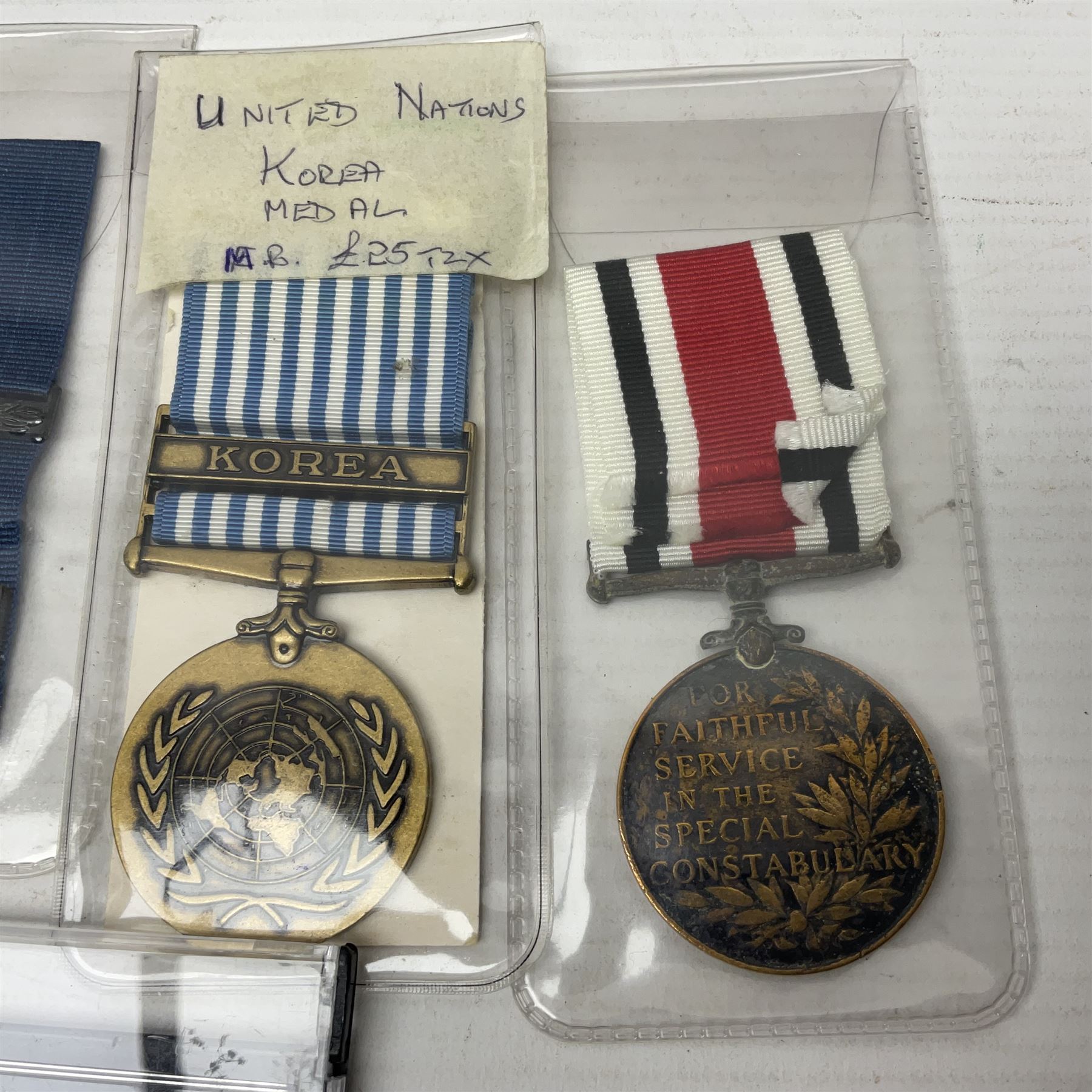 Two Imperial Service Medals to Elsie Hannah Ferguson and Fred Whitehead; each in original case; WWI Special Constabulary Medal to Inspr. Alfred W. Thompson; modern Prisoner of War Medal; cased; replica Victoria Cross and India Mutiny Medals with archive of information relating to Pte. Robert Newell V.C. 9th Lancers; replica Victoria Cross and George Cross with miniatures; and other replica medals etc