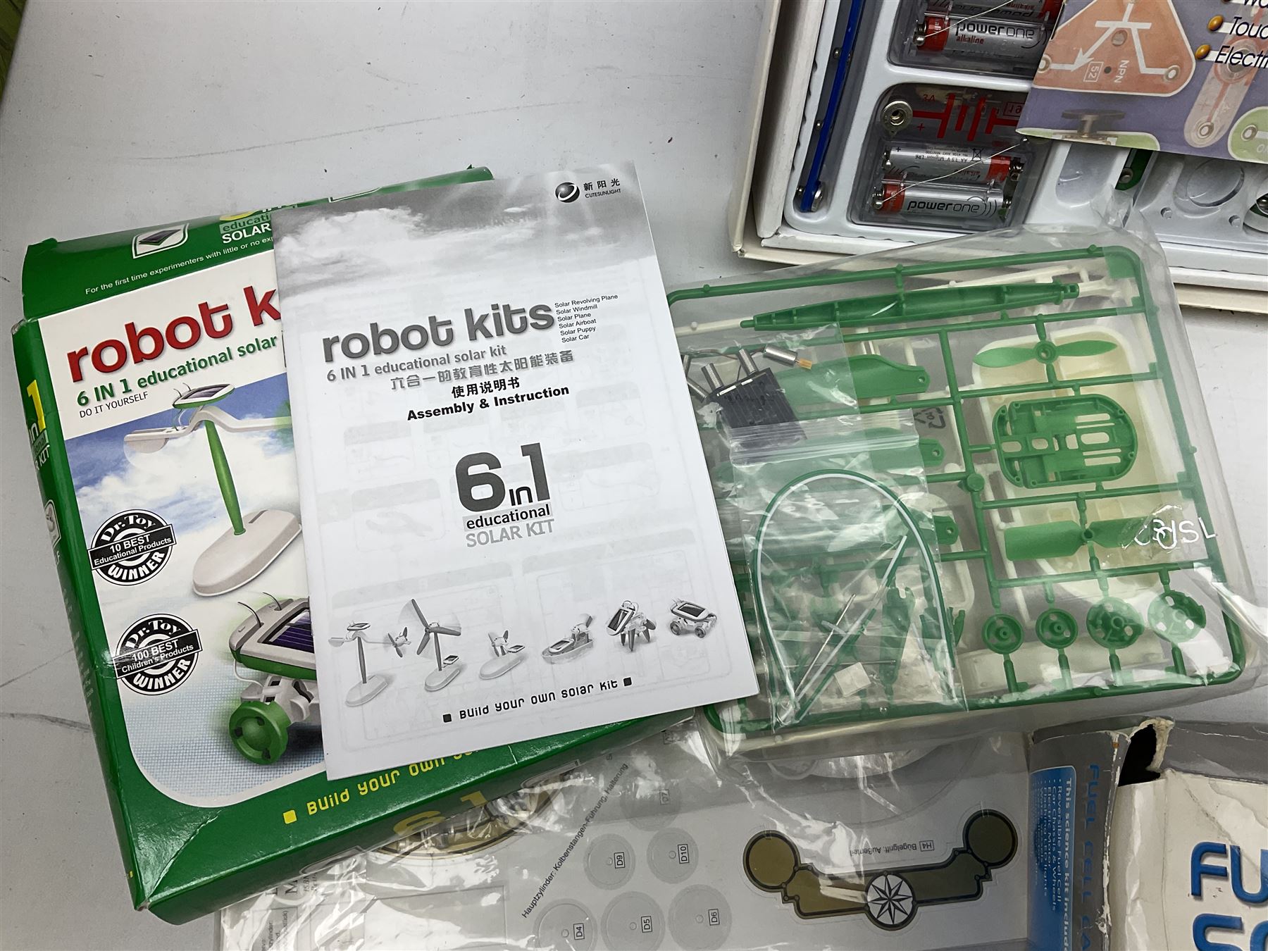 Scientific toys including Electronic Experiment Kit; Fuel Cell Car Science Kit; Robot Kits 6-in-1 Educational Solar Kit; all boxed; remote control helicopter; and two others