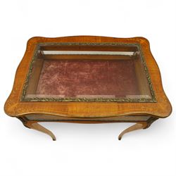 Louis XV revival style walnut bijouterie table, rectangular serpentine form, with brass edging and a hinged floral marquetry inlaid lid with bevelled glass top and sides, gilt-bronze beaded border, interior lined with rich red velvet, raised on slender cabriole legs with gilt bronze masks and sabots, circa 1900
