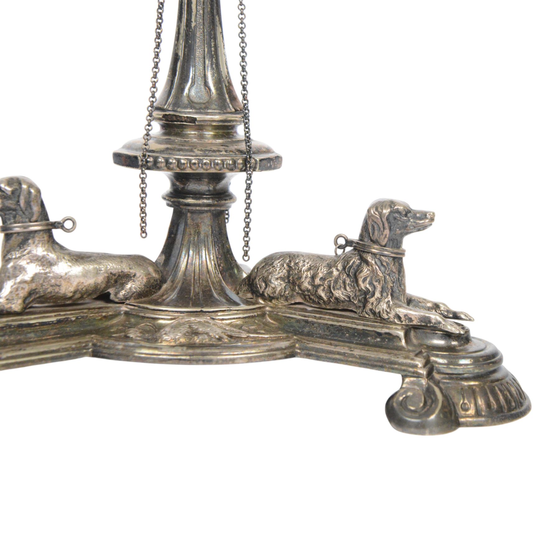 Edwardian silver plated centrepiece stand, the tripart base with applied recumbent hunting dogs interspersed with fox masks and game birds, the central knopped and tapering stem leading to a circular stand, marked 3251 beneath, H22cm  