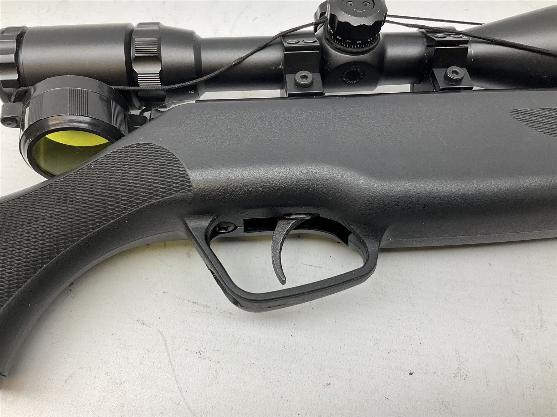 Stoegar .177 air rifle with break barrel action, 3 x 9 telescopic sight and fully integrated sound moderated barrel, no visible serial number, L109cm; in Stoeger lined gun sling