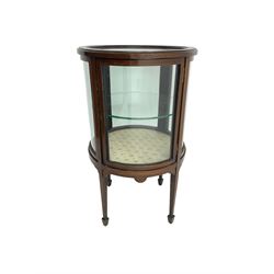 Edwardian inlaid mahogany drum shaped vitrine or bijouterie table, with glass top and sides and single door with central glass shelf, on four tapering square supports with spade feet