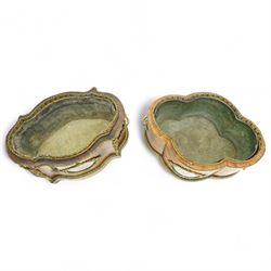 Matched pair of 19th-century French Kingwood and gilt brass mounted table jardinières, quatrefoil-shaped form with original zinc liners, foliate gilt brass mounted pierced gallery above kingwood crossbanded sides and inset serves style porcelain plaque and gilt brass carrying handles on plinth base