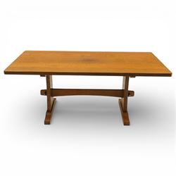 Beaverman - oak adzed top refectory table, the rectangular top raised on twin trestle supp...