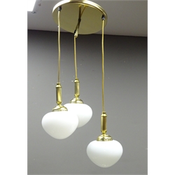  Two matched Darr lighting centre light fittings, the gilt metal fitting having five descending pendant drops with opaque bulbous glass shades and the other having three, H88cm & H67cm   