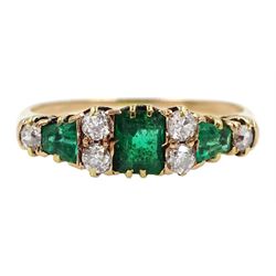 18ct gold emerald and diamond ring, central emerald with two tapered emeralds either side and six old cut diamonds set between