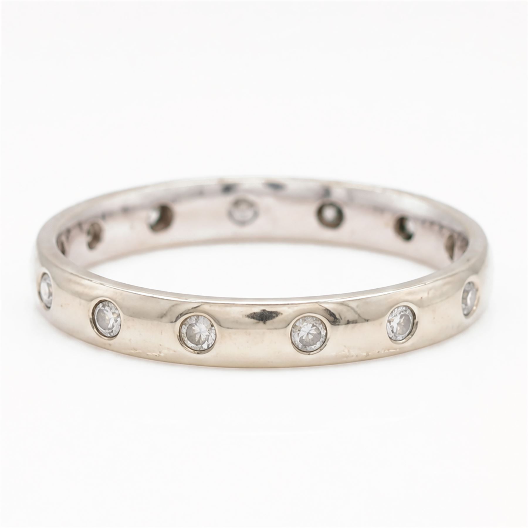9ct white gold diamond wedding band, rubover set with fourteen round brilliant cut diamonds, hallmarked