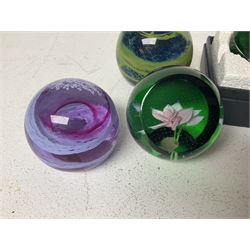 Twelve Caithness glass paperweights, to include Pastel, Mooncrystal and Fiesta, together with Baccarat 'The Princess Anne' paperweight and two Mdina examples (15)