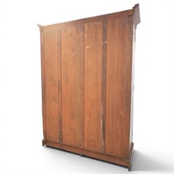 Edwardian walnut double wardrobe, fitted with two panelled doors, opening to reveal fitted interior with hanging space, three sliding linen trays and three drawers
