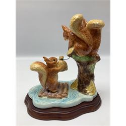 Four Border Fine Arts Beatrix Potter figures, comprising Tableau created to commemorate the Millenium together with a Border Fine Arts Limited Edition no 669814, The Tale of Peter Rabbit Tablet A1306, Four Little Rabbits A2442 and Sailing Home A2443