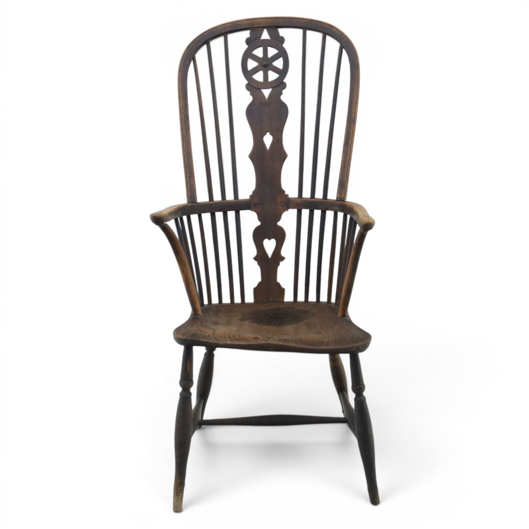 19th century Provincial wheelback Windsor armchair, high stick back, saddle seat on four turned legs with H-stretchers