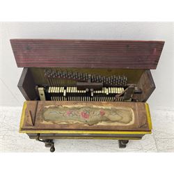 Faventia Half size miniature Spanish barrel piano with a 40cm cylinder playing tunes on a 37 note movement including woodblock and triangle, in a painted case with silk embroidered decoration to the front.  Vicente Linares, Barcelona trade label, with original crank handles, stringing, hammers action, tuning pins and cylinder