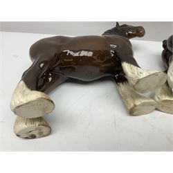 Four Beswick horse figures, comprising Quarter Horse, two Shires no 818 and matt palomino, together with Beswick donkey and Royal Doulton horse on a wooden plinth  