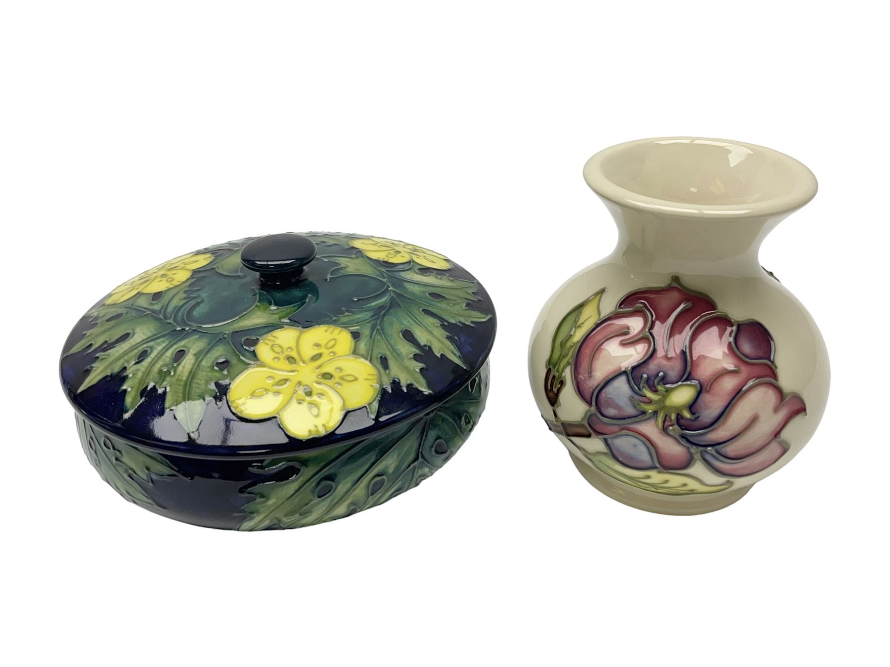 Moorcroft dish and cover, of circular form, decorated in Buttercup pattern, together with a Moorcroft vase, of baluster form, decorated in Magnolia pattern, both with printed marks beneath, tallest H9.5cm