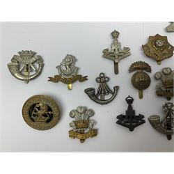 Over thirty regimental cap badges for fusiliers, Yorkshire interest, Light Infantry etc including Royal Scots and Welsh fusiliers, Durham L.I., KO Yorkshire L.I., Oxford & Bucks L.I., Green Howards, East Yorkshire, West Riding, York North Riding etc 