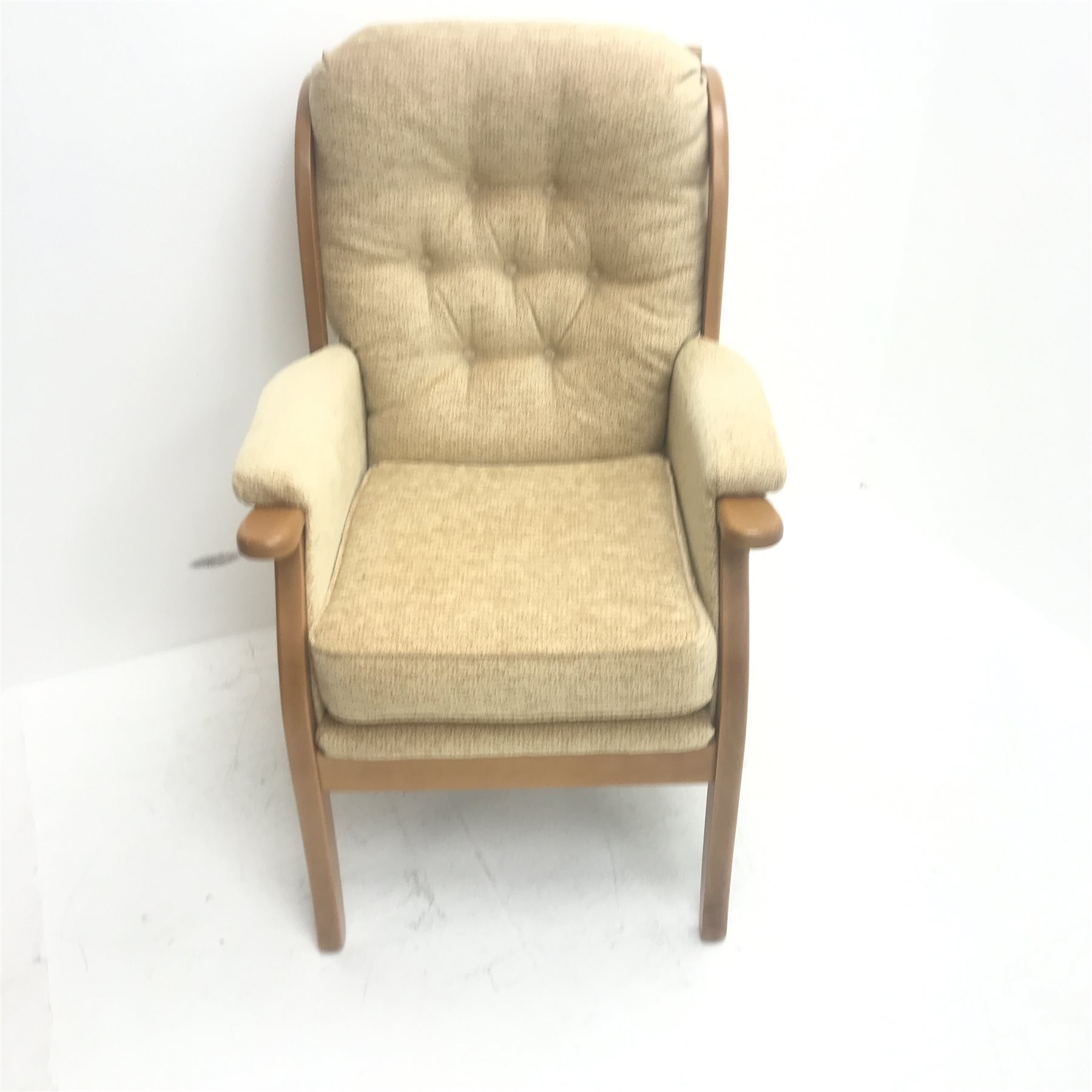 Beevers beech framed high seat armchair, upholstered in a seep buttoned beige fabric, W68cm