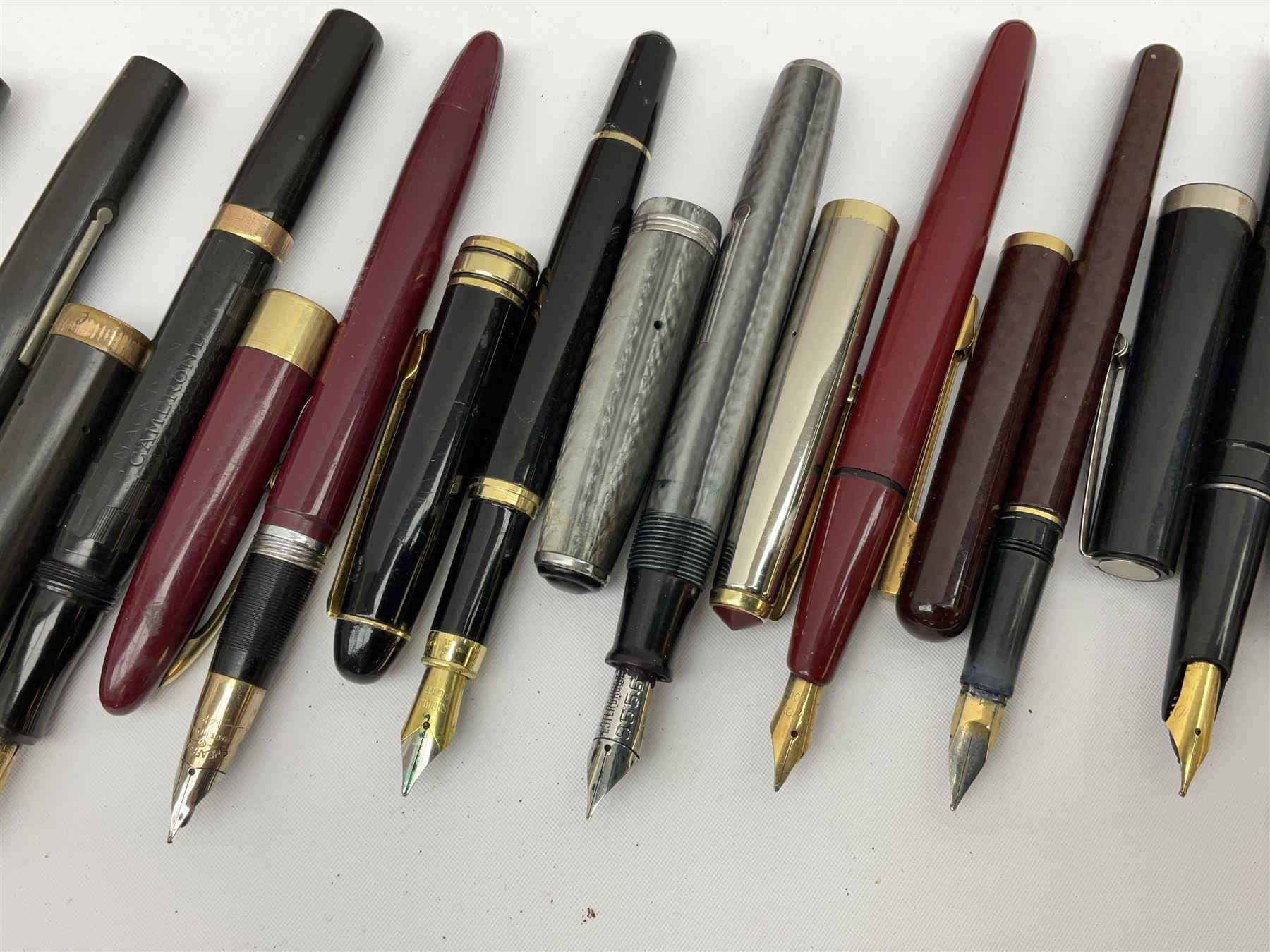 Six fountain pens with gold nibs to include Sheaffer, Macniven & Cameron Ltd and Conway examples, together with four other fountain pens including a boxed Parker pen and a boxed Sheaffer pen in black case with chevron pattern detail