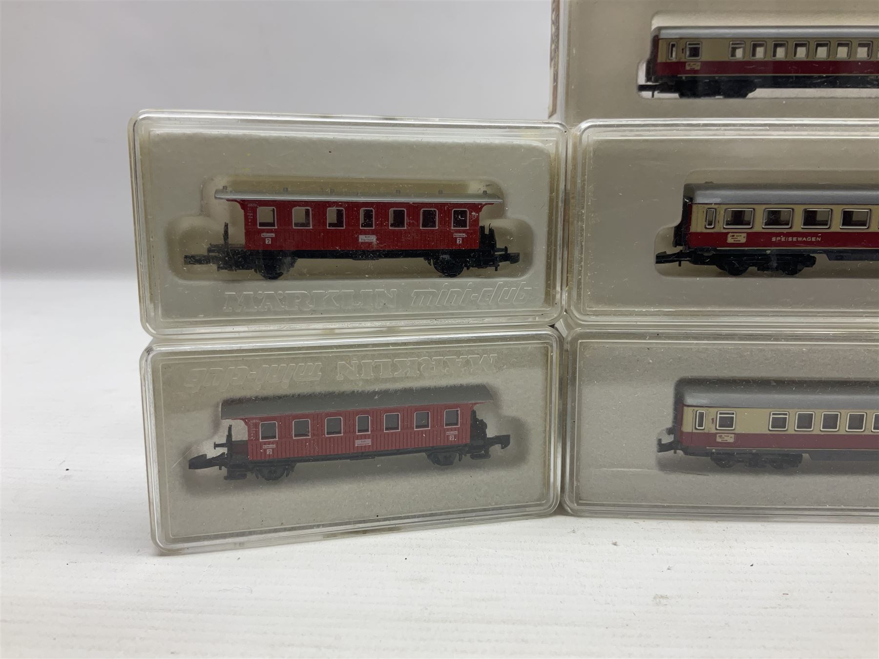 Marklin mini-club 'Z' gauge - twelve passenger coaches nos.8610, two 8611, 8613, 8700, two 8701, 8720, 8721, 8722, 8723 and 8725; together with four others in two unassociated boxes; all in hard plastic boxes (16)