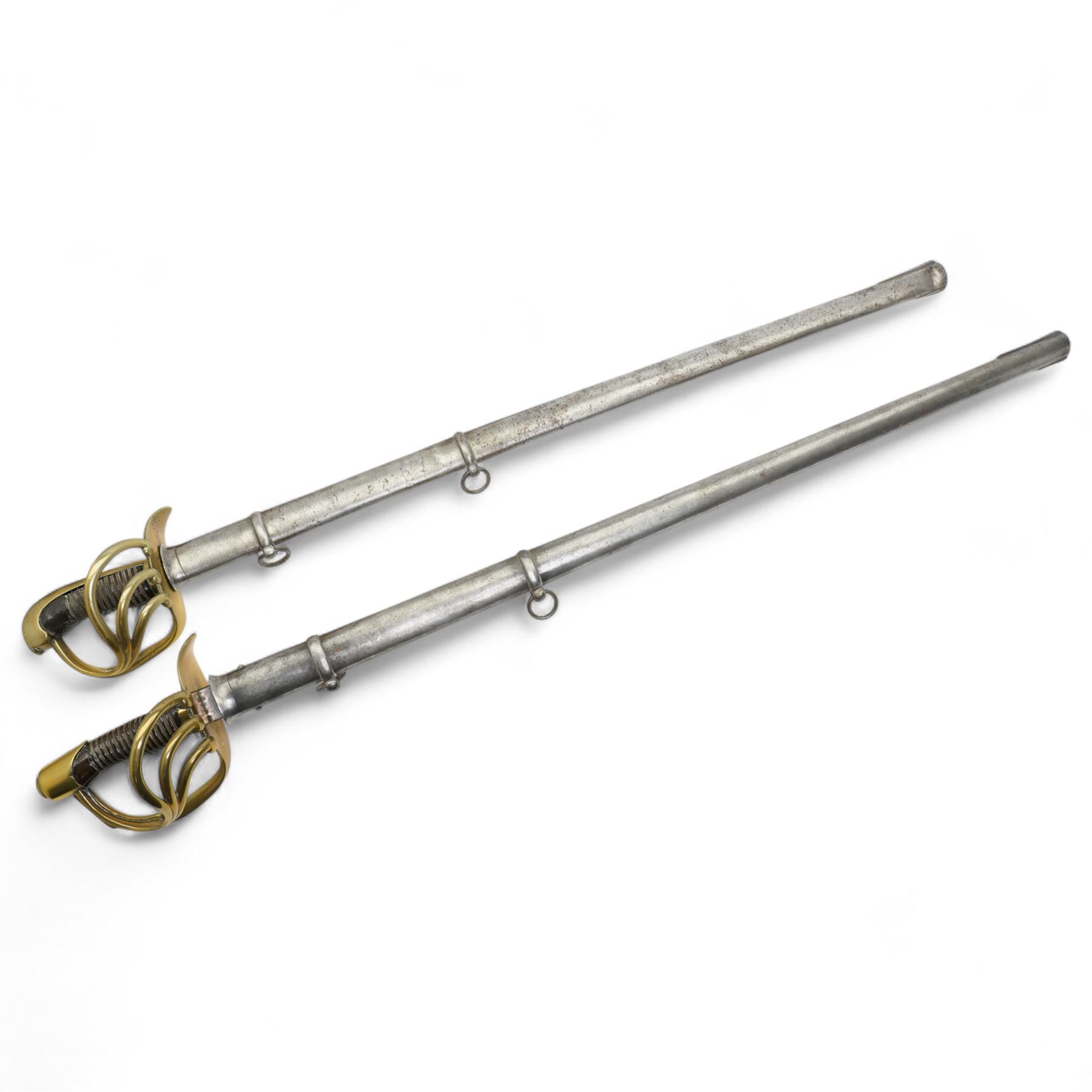 19th century Spanish cavalry sword, the blade marked 'Toledo 1868' with pierced brass hilt and wire wound grip with steel scabbard, blade length 93cm and another similar Spanish sword, unmarked blade (2)