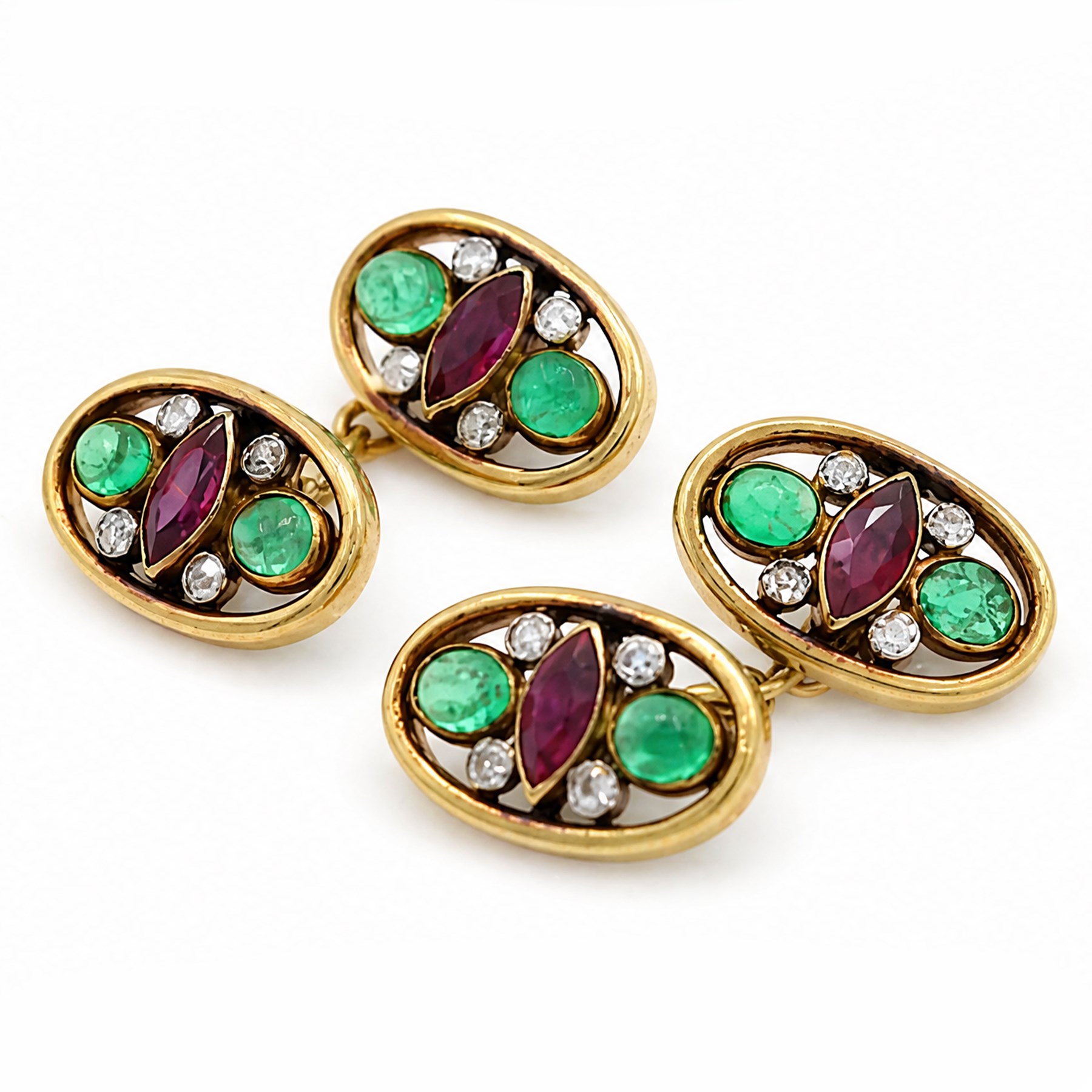 Pair of 18ct gold ruby, emerald and diamond cufflinks, each head openwork set with two oval cabochon cut emeralds, four milgrain set round cut diamonds and a marquise cut ruby  