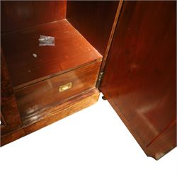 Victorian figured walnut double wardrobe, projecting moulded cornice over twin arched silvered mirrored doors, fitted with hanging rail and drawer with campaign style handle, on plinth base