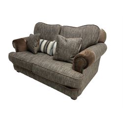 'Canterbury' two seat sofa upholstered in brown fabric with contrasting textures, traditional shape with scrolled arms and studded bands, on turned feet