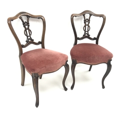  Pair Victorian rosewood bedroom chairs, shaped cresting rail, carved and pierced splat, upholstered serpentine seat, cabriole legs, W46cm  