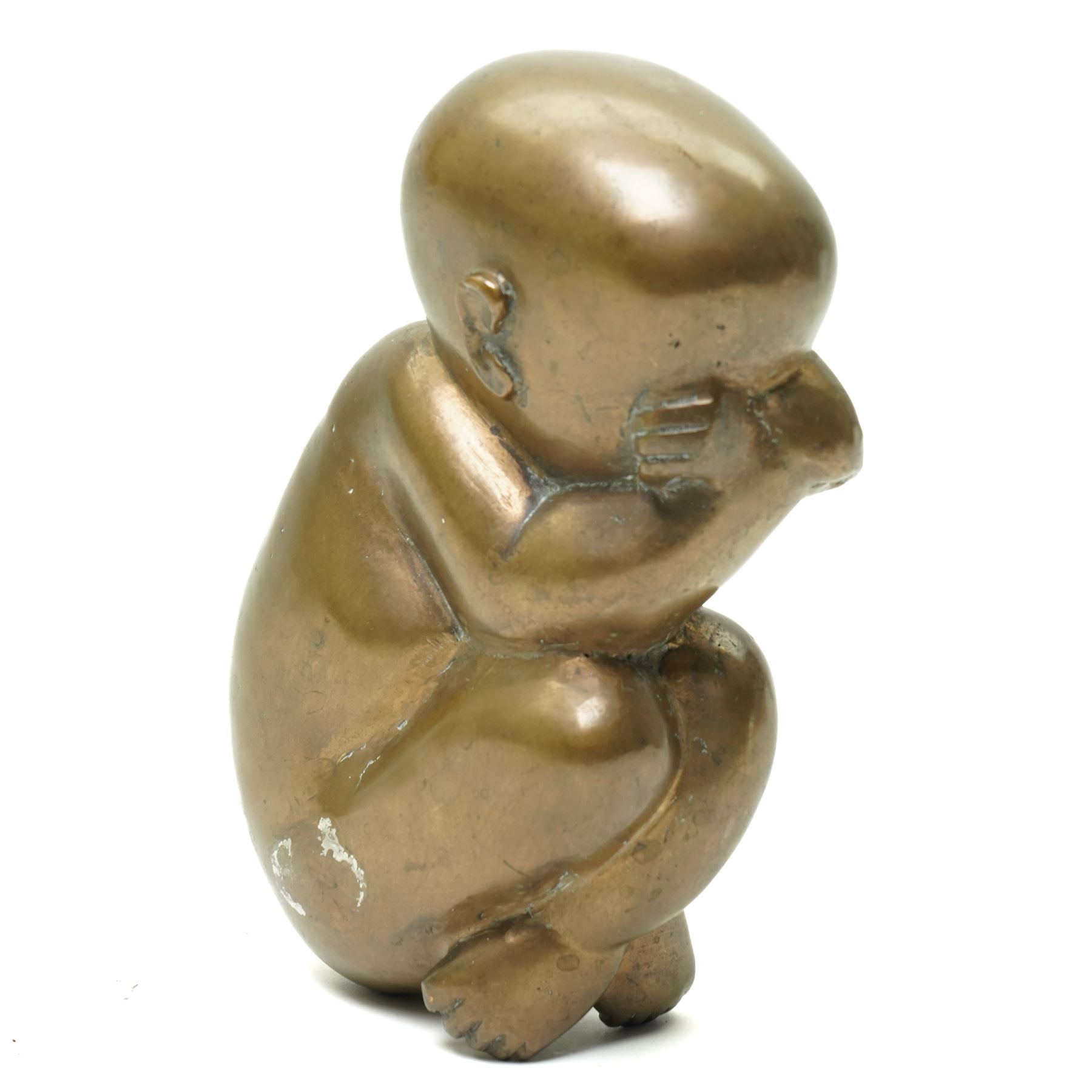 Catharni Stern (British 1925-2015) -  Bronze sculpture of a baby in the foetal position 22cm, etched signature and with Alwin Gallery leaflet 