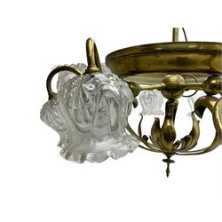 Mid-20th century brass lightolier or light fitting, the scrolling foliate branches connected with a central ring, terminating in ten tulip shaped cut glass sades, pointed terminal beneath