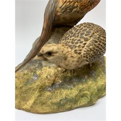 A North Light figure modelled as a cock and hen pheasant upon rocky ground, signed J Stanbridge 82, H26cm L30cm