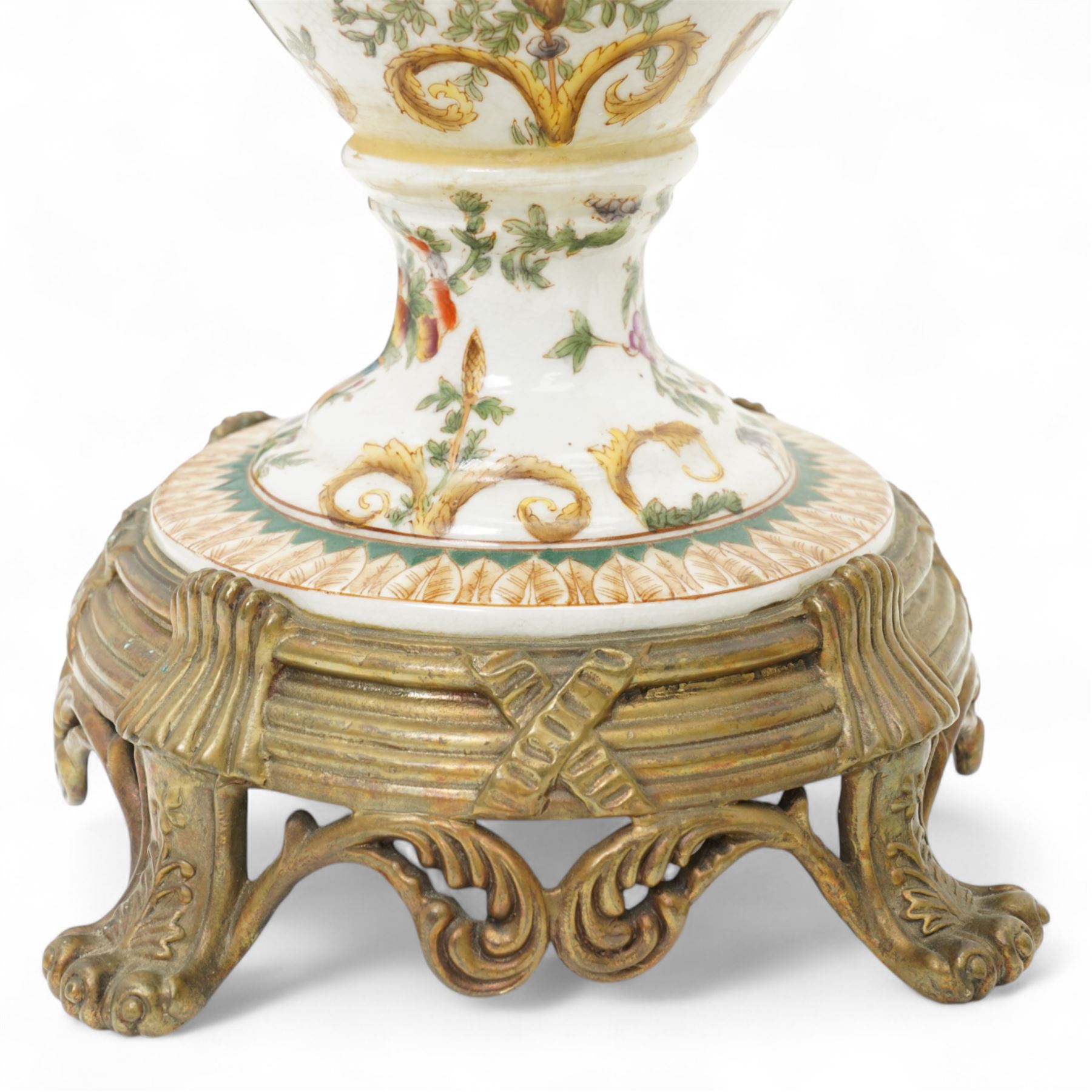 Wong Lee twin handled ceramic urn, with enamelled cherubs among animals and foliate decoration with bronzed metal mounts, upon a square base with paw feet, together with similar twin handled urn with enamelled floral decoration, marked to base, largest H48cm (2)