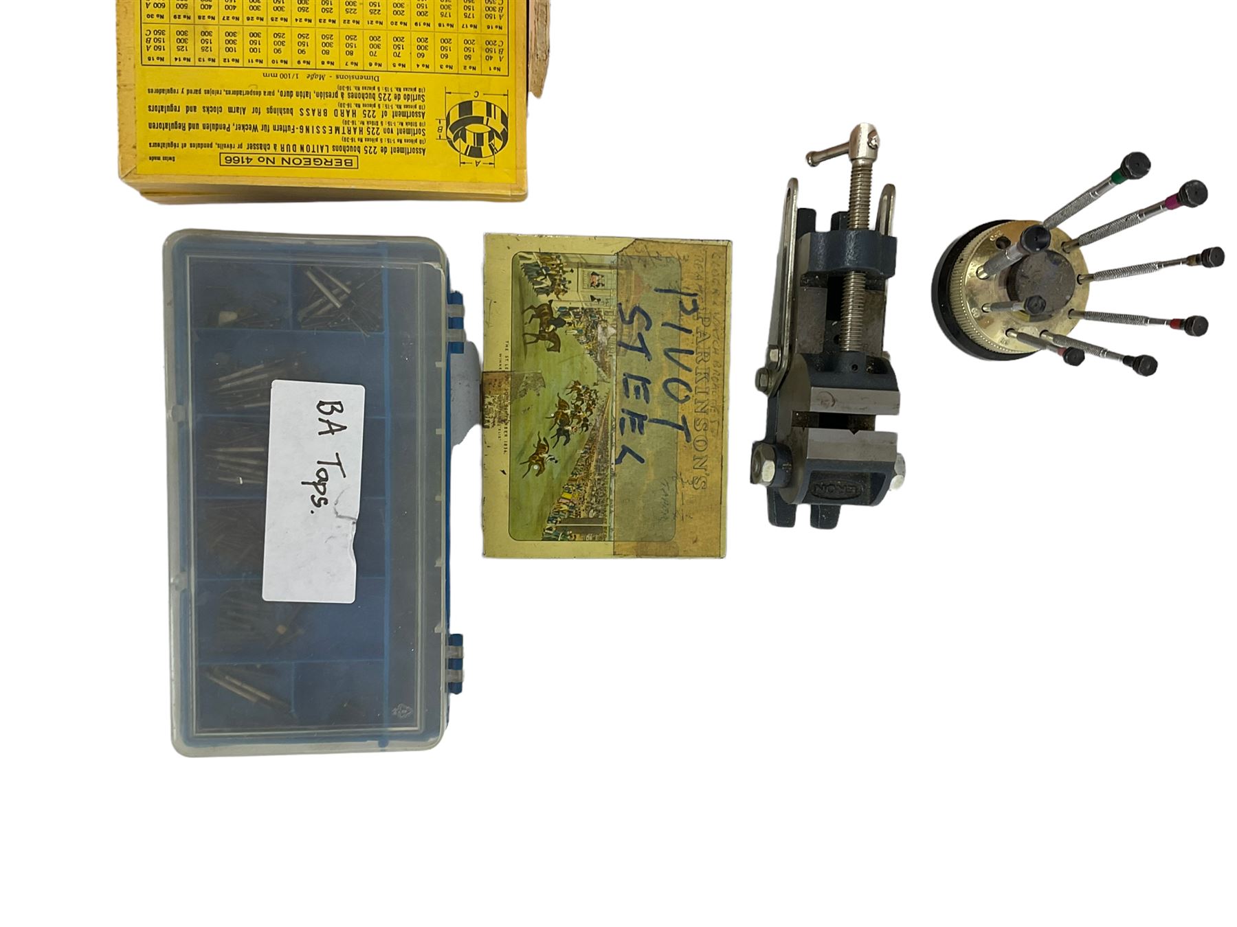 Clock mainspring winder, bench vice, assortment of clock pivot steel