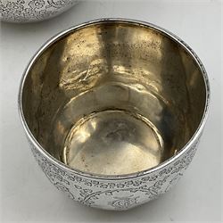 Late Victorian silver bachelors three piece tea service, comprising bullet shaped teapot, open sucrier and milk jug, each engraved with monogram surrounded by birds upon and amidst a blossoming vine, the teapot with scroll capped curved wooden handle and wooden finial to cover, hallmarked Wakely & Wheeler, London 1890, teapot including handle H12cm, sucrier H5.5cm 