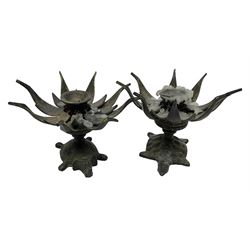 Pair of candlesticks, modelled as opening and closing lotus flowers upon tortoise and elephant, D13cm