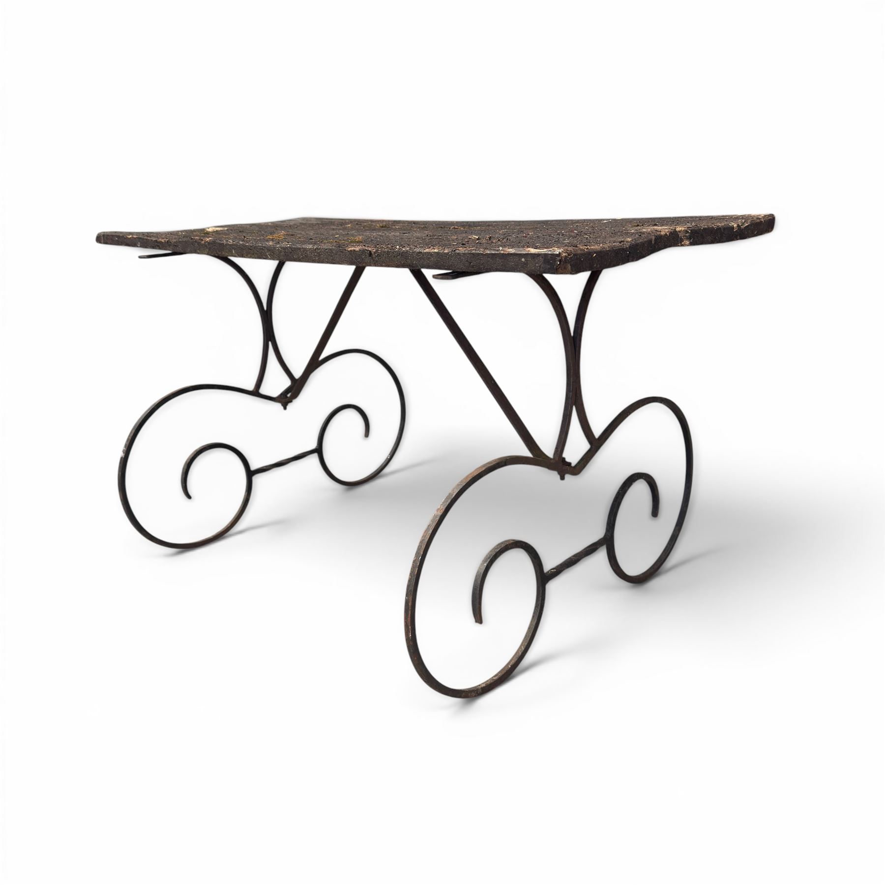 Cast iron garden table, with rectangular weathered slatted wooden top, raised on iron strapwork supports of scrolling form, in black painted antique finish 