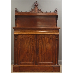  Victorian mahogany Gothic Revival chiffonier, raised shelf back with shaped cresting on pierced scroll supports, base with concealed frieze drawer above a pair of matched veneer panel doors enclosed by pilasters, interior with shelves on a skirted base, W108cm H166cm, D55cm    