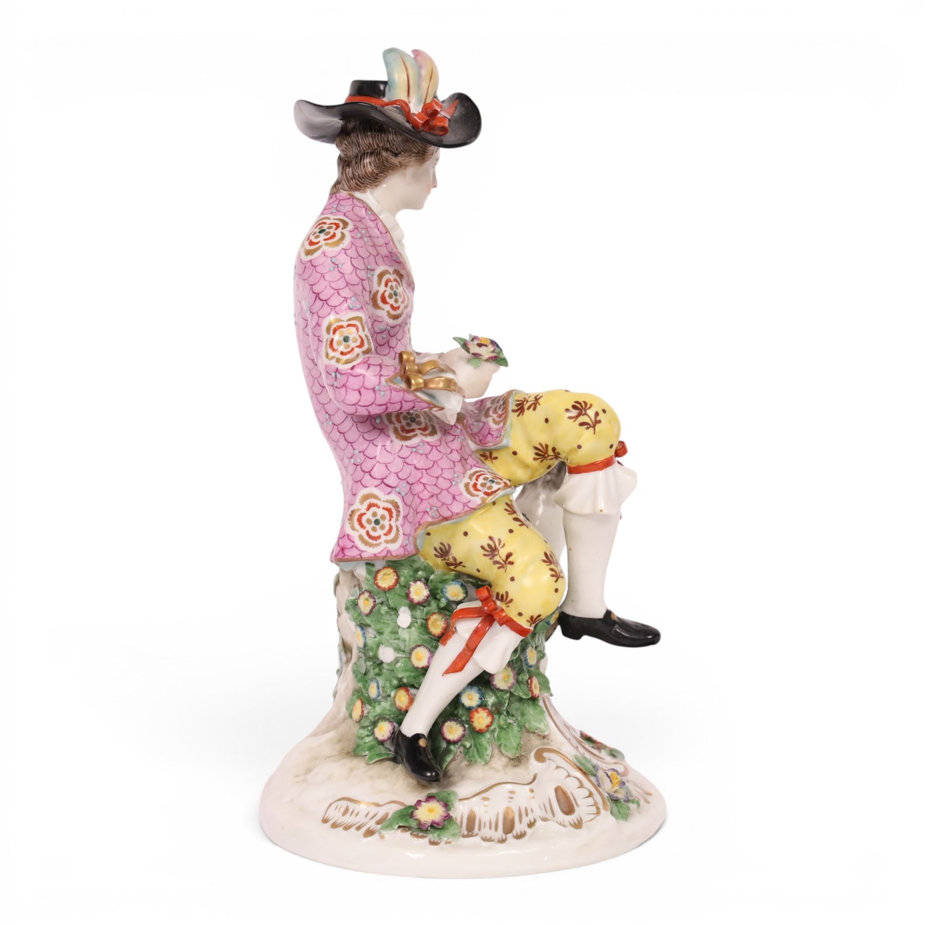 Pair of 19th century Samson figures, the gentleman wearing a wide brimmed hat with a dog, the lady with a sheep by her side, both figures seated upon a floral encrusted pillars with gilt scrolling base, H22cm