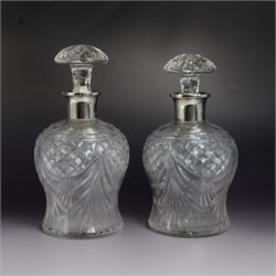 Pair of 1930s cut glass decanters, each with silver collars, hallmarked Mappin & Webb Ltd,...