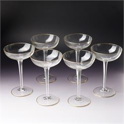 Set of six Wiener Werkstatte champagne coupe glasses, with gilt trimmed rim and foot, the ...