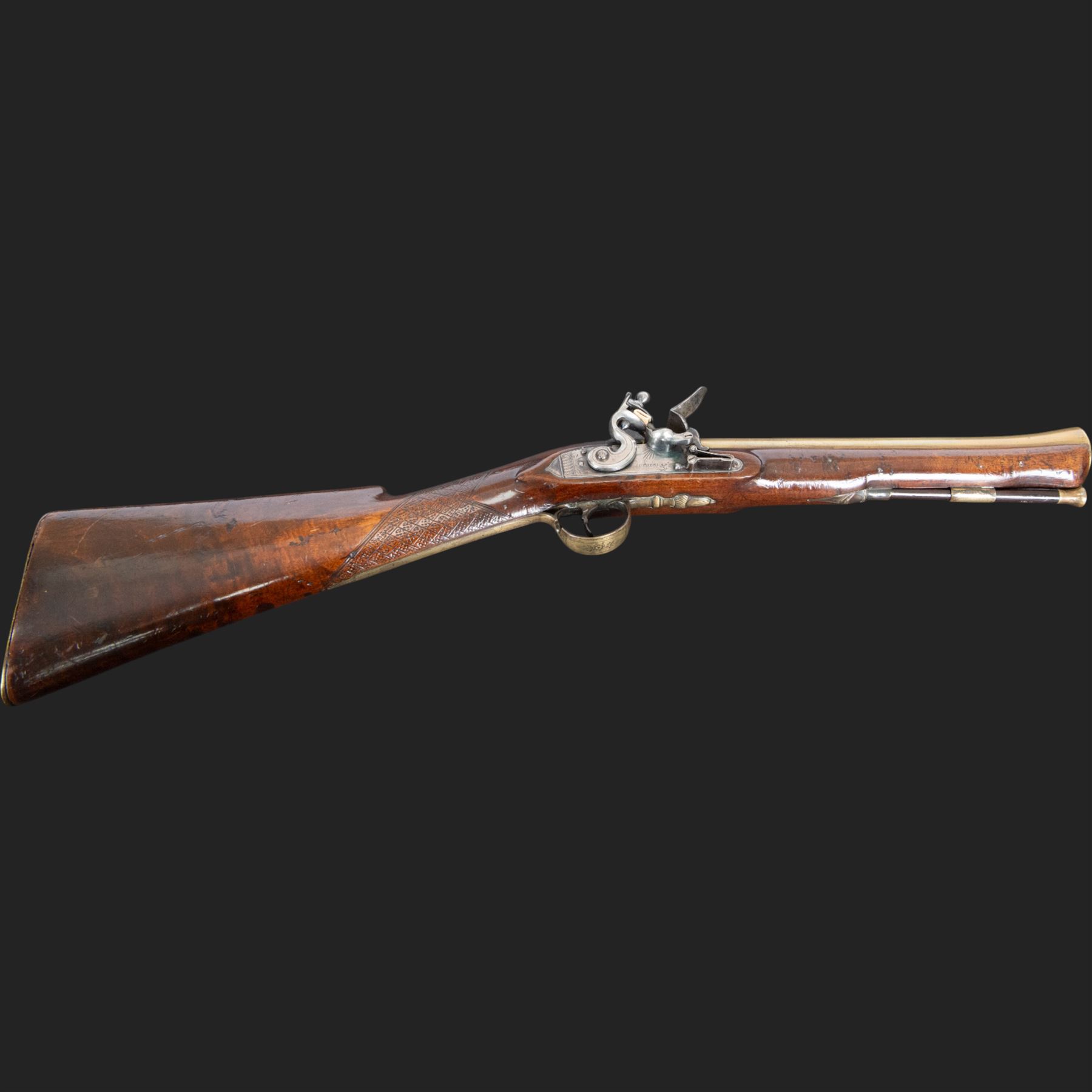 English flintlock blunderbuss, circa 1780 by R. Sutherland of London, the 32cm brass barrel with proof marks and London to the top, with original ramrod with brass tip below, the lock engraved Sutherland, walnut stock with brass butt plate, steel trigger guard with acorn finial, overall L70cm  