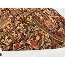 Ikat Man’s Cloth (Hinggi Kombu), East Sumba, Indonesia, woven in red, blue and yellow-brown warp ikat, constructed of two mirroring long panels, the motifs arranged in four bands depicting warrior figures astride rearing horses, high-ranking figures and guardians within geometric borders, on carved wooden wall hanger, L295cm
