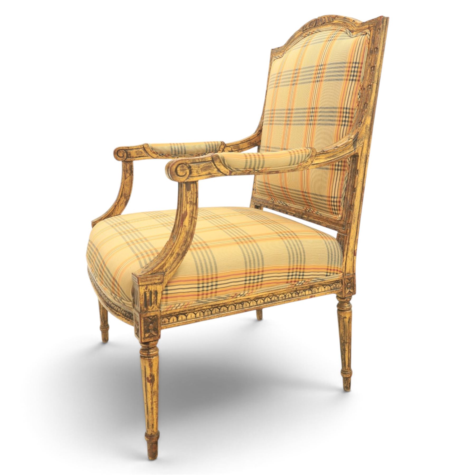 Louis XVI style painted fauteuil, the shaped padded back and overstuffed seat upholstered in cream tartan fabric, with scrolling open arms on fluted supports, the moulded frame with carved ribbon twist, rosette and husk decoration, raised on turned and fluted tapering legs