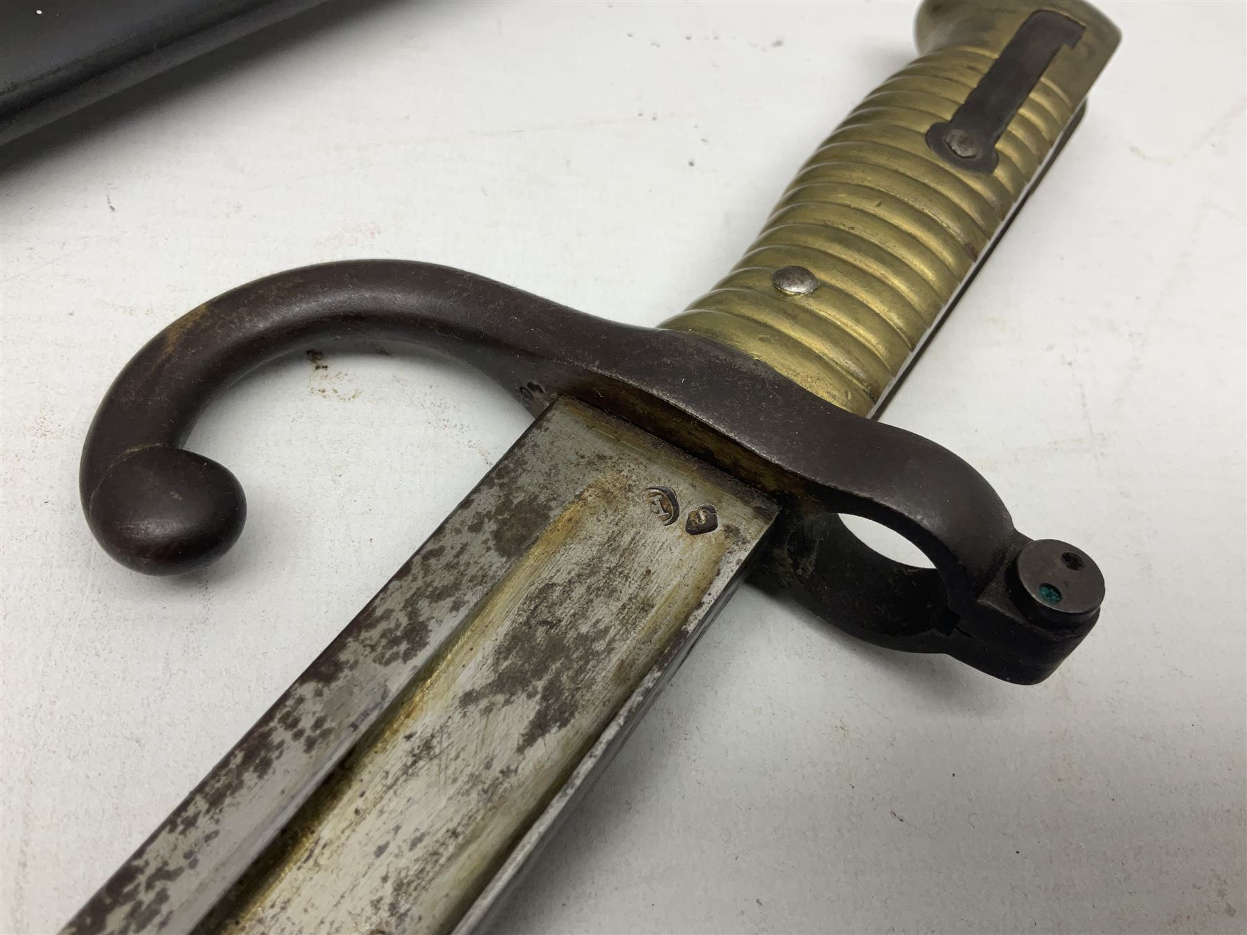 French Model 1866 Chassepot bayonet with 57cm curving fullered steel blade dated 1873 No.L63963; in steel scabbard with conforming number L71.5cm overall; and French St. Etienne Gras bayonet dated 1878 No.K10674 in steel scabbard numbered 79437 (2)