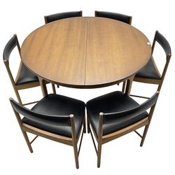 AH McIntosh & Co of Kirkaldy - mid-20th century teak extending dining table, circular top, concealed integrated double leaf, raised on tapered supports, label plaque to underside of leaf, together with a set of six chairs upholstered in black leatherette