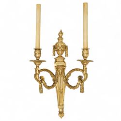 Pair of 19th-century Louis XVI-style ormolu rams-headed two-light wall appliques, the arms joined by a garland of laurel leaves, the half fluted stem surmounted by a vase with laurel garland, wired for electricity 