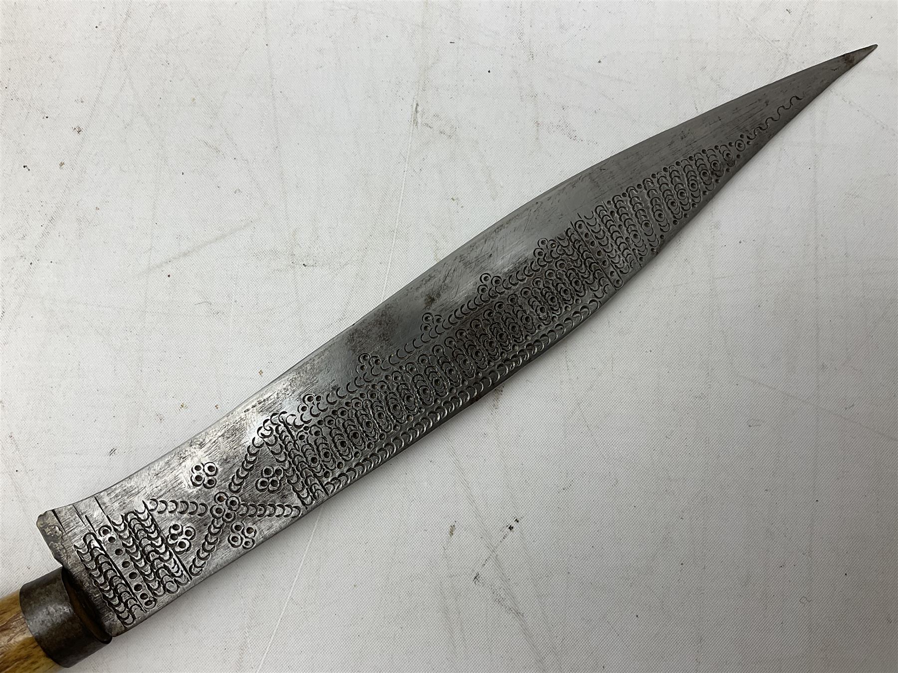 African tribal knife, possibly Shona Zimbabwe, the 22cm steel blade with all over punched decoration and antler handle; in inlaid and banded hardwood scabbard with two apertures L42cm overall