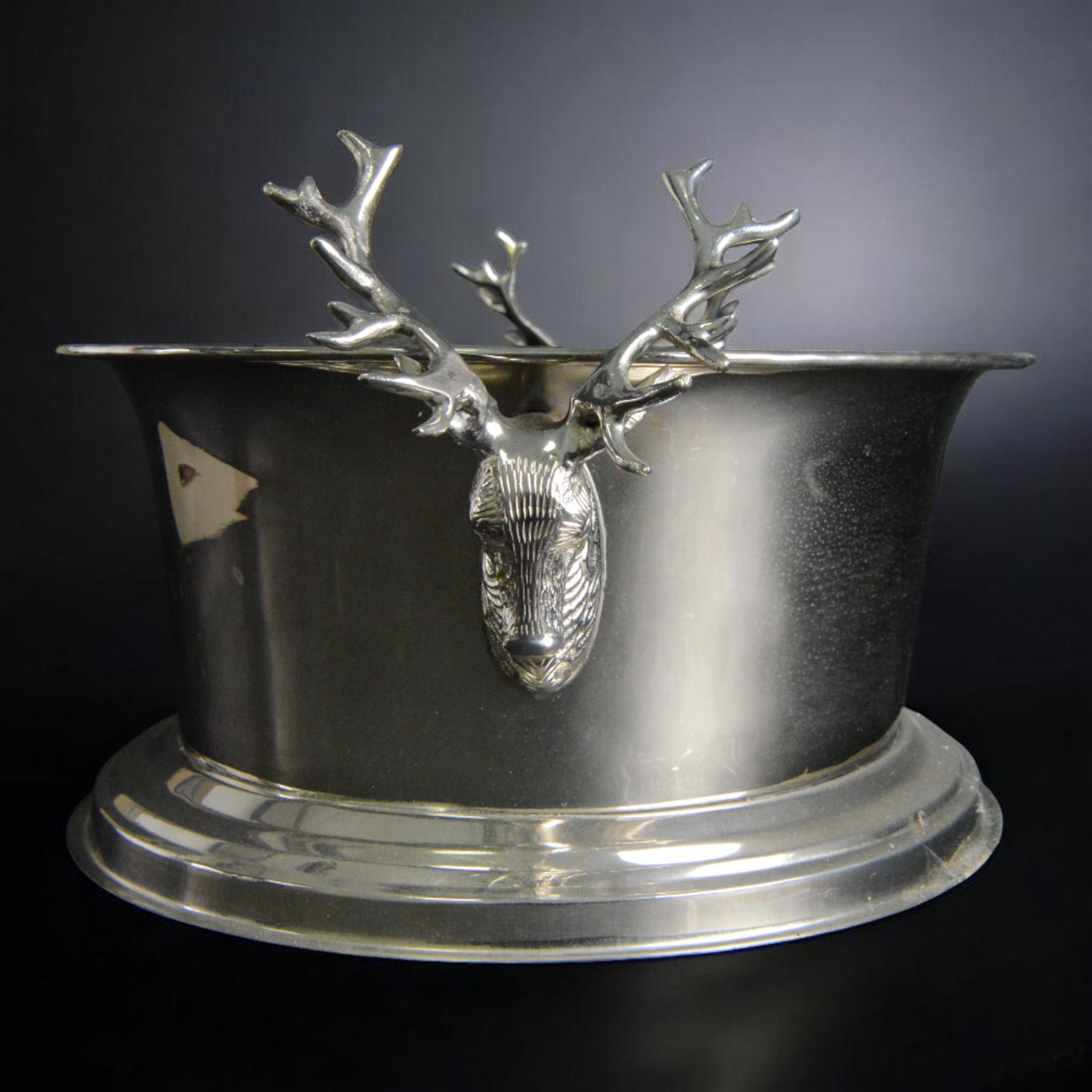 Large oval silver plated champagne cooler, with stag handled, upon a stepped base, H16cm, L38cm