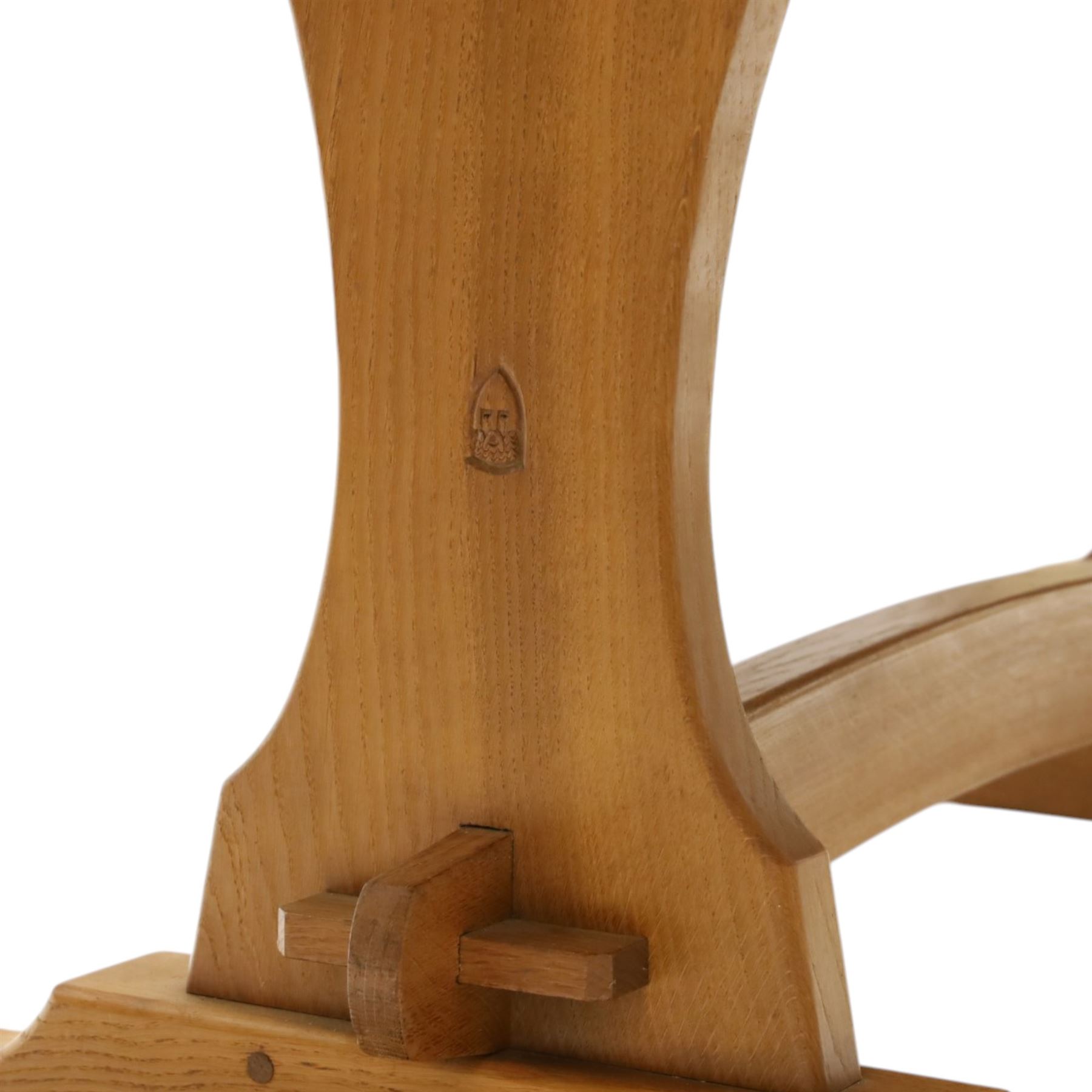 Knightman - oak refectory dining table, the rectangular adzed top raised on shaped trestle supports joined by central stretcher, with recessed carved knight trademark, by Horace Knight of Old Mill Furniture, Balk near Thirsk