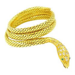18ct gold coiled diamond snake bangle, the head set with round cut diamonds and emerald eyes, to an expanding articulated body, stamped Brevete S.G.D.G.